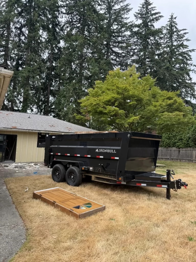 Commercial junk removal trailer at a commercial remodeling project.
