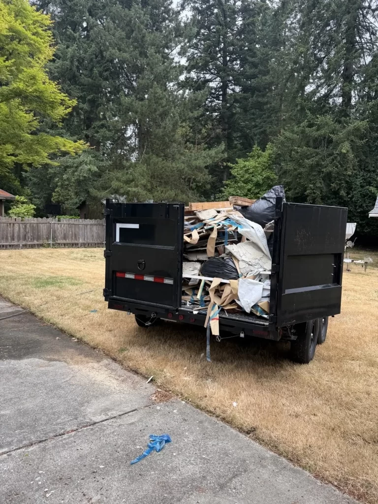 Loaded trailer with commercial construction debris ready for disposal.